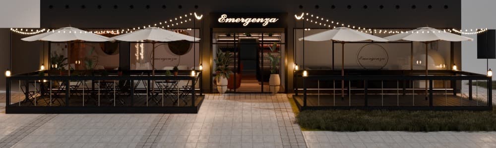 Čelní pohled na bistro večer — dvě terasy se slunečníky, světelné řetězy, podsvícený nápis nad vstupem